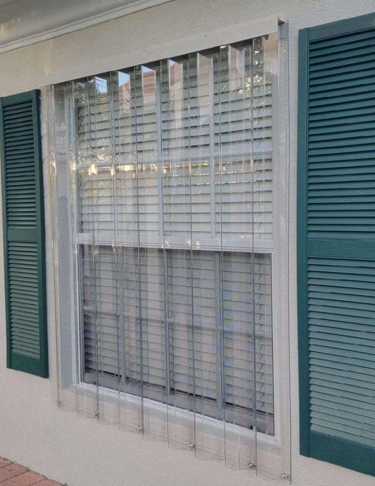 Clear polycarbonate storm panels installed over windows in Bonita Springs